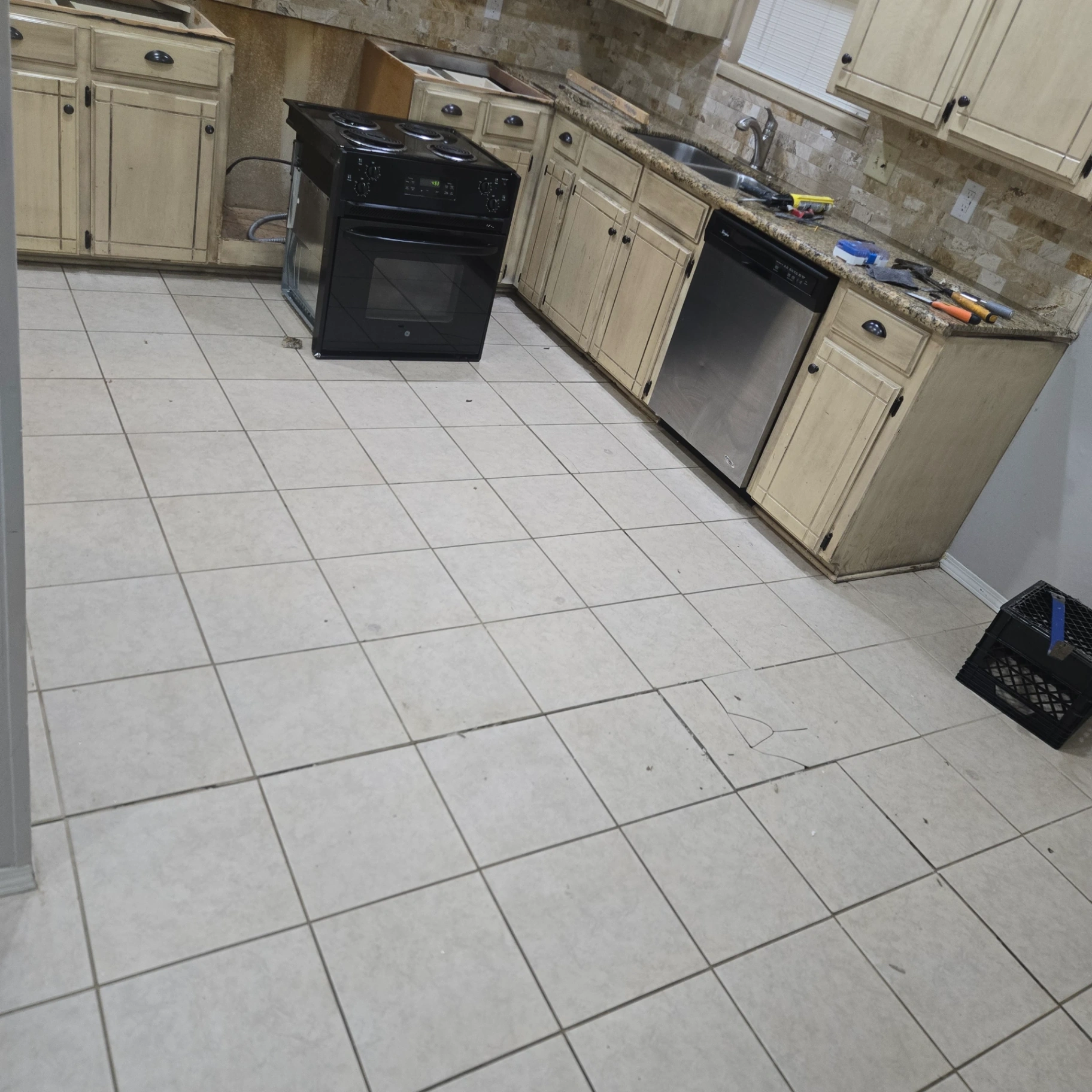 Kitchen with professionally installed appliances including range, dishwasher, and cabinets in Stillwater, OK
