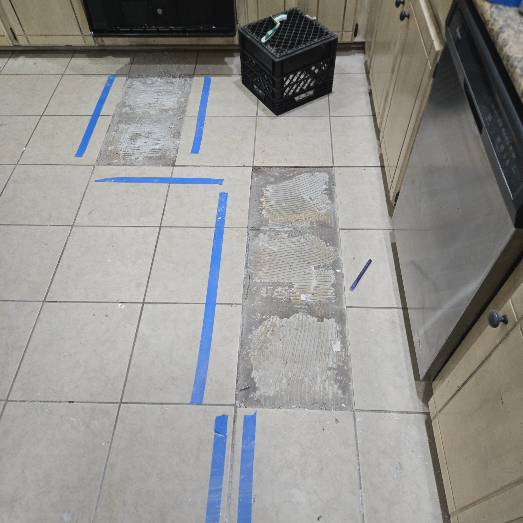 Floor tile repair and replacement in Carney kitchen