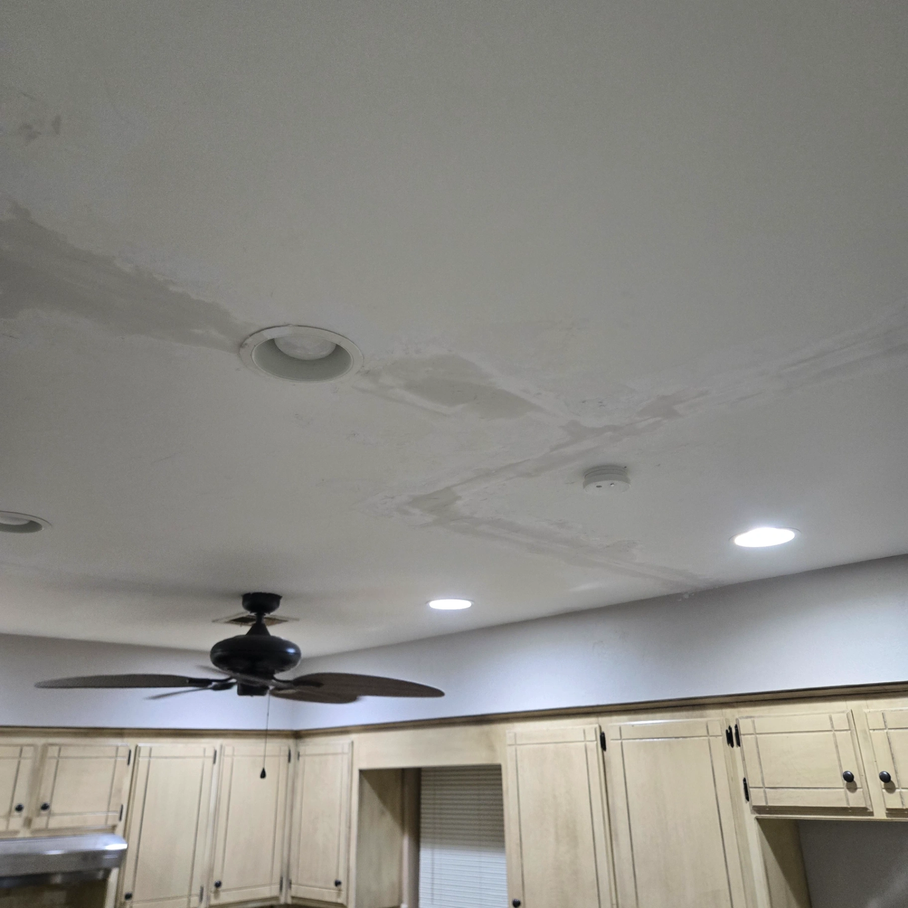 Water stain damage on ceiling requiring professional drywall repair in Stillwater OK