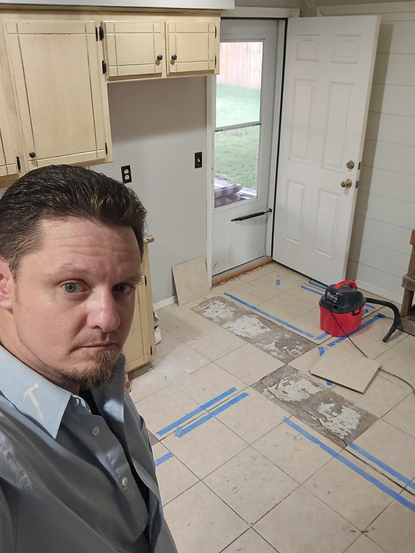 Stillwater Handymen preparing floor for tile installation in kitchen