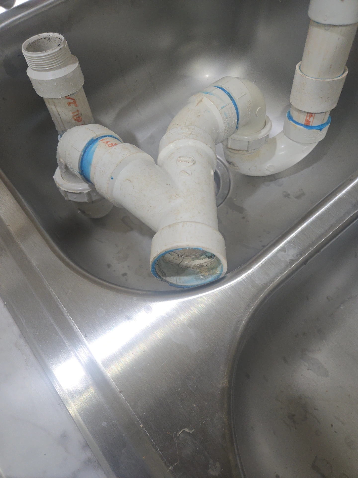 Drain pipe repair service showing PVC plumbing work in Stillwater OK