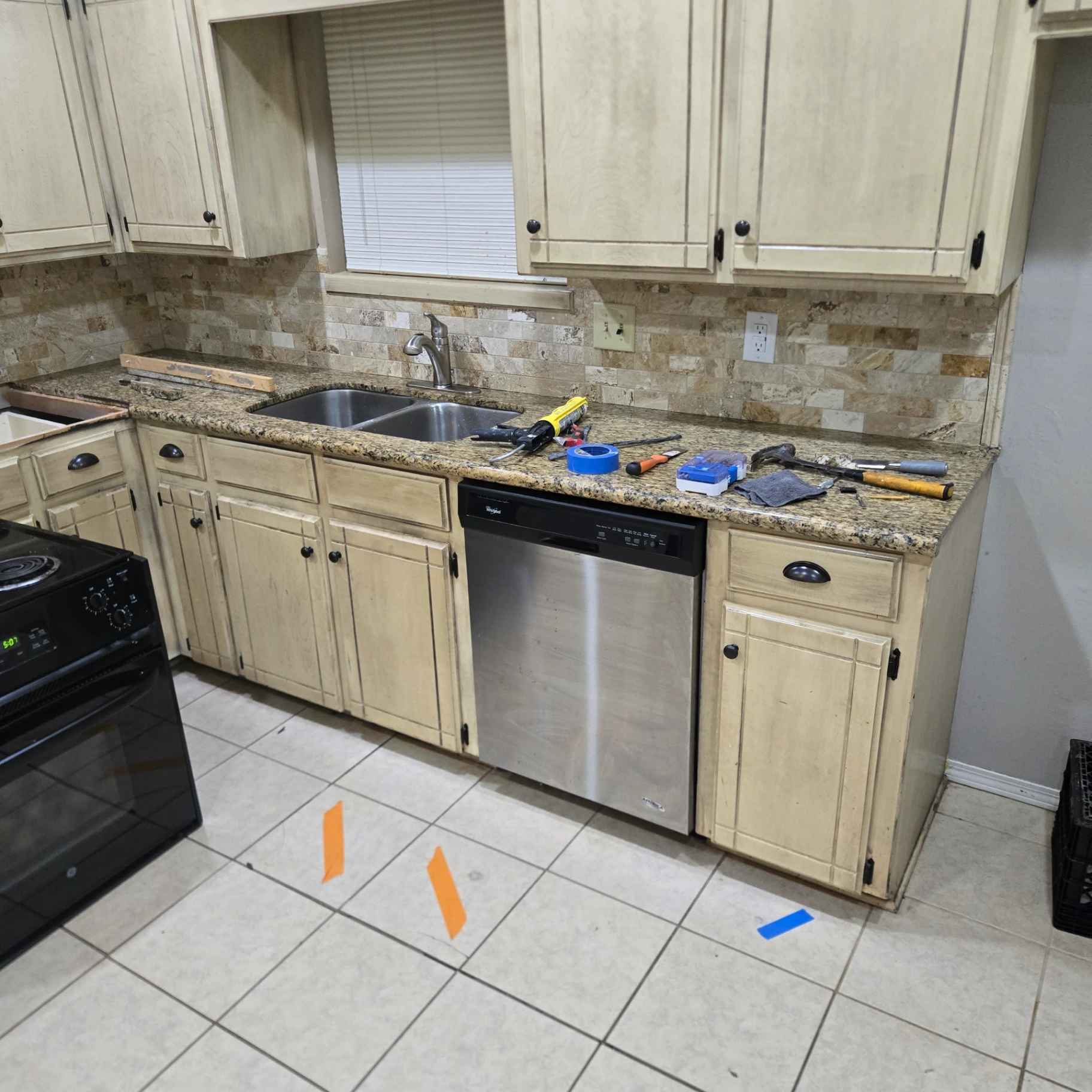 Kitchen backsplash and cabinet work in Carney home