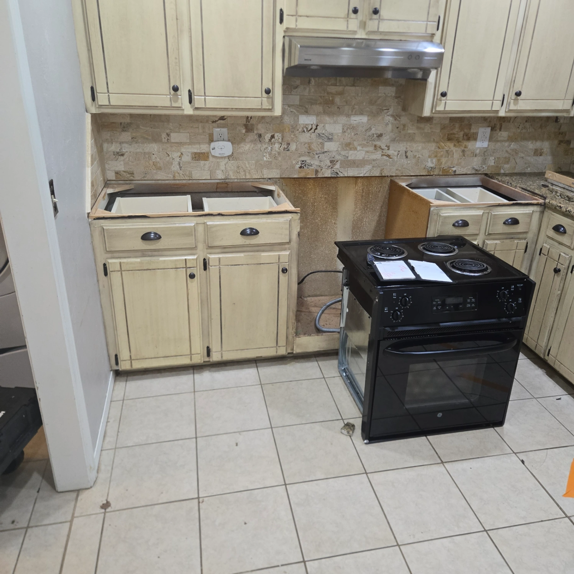 Appliance installation in progress showing range and kitchen preparation in Stillwater, OK