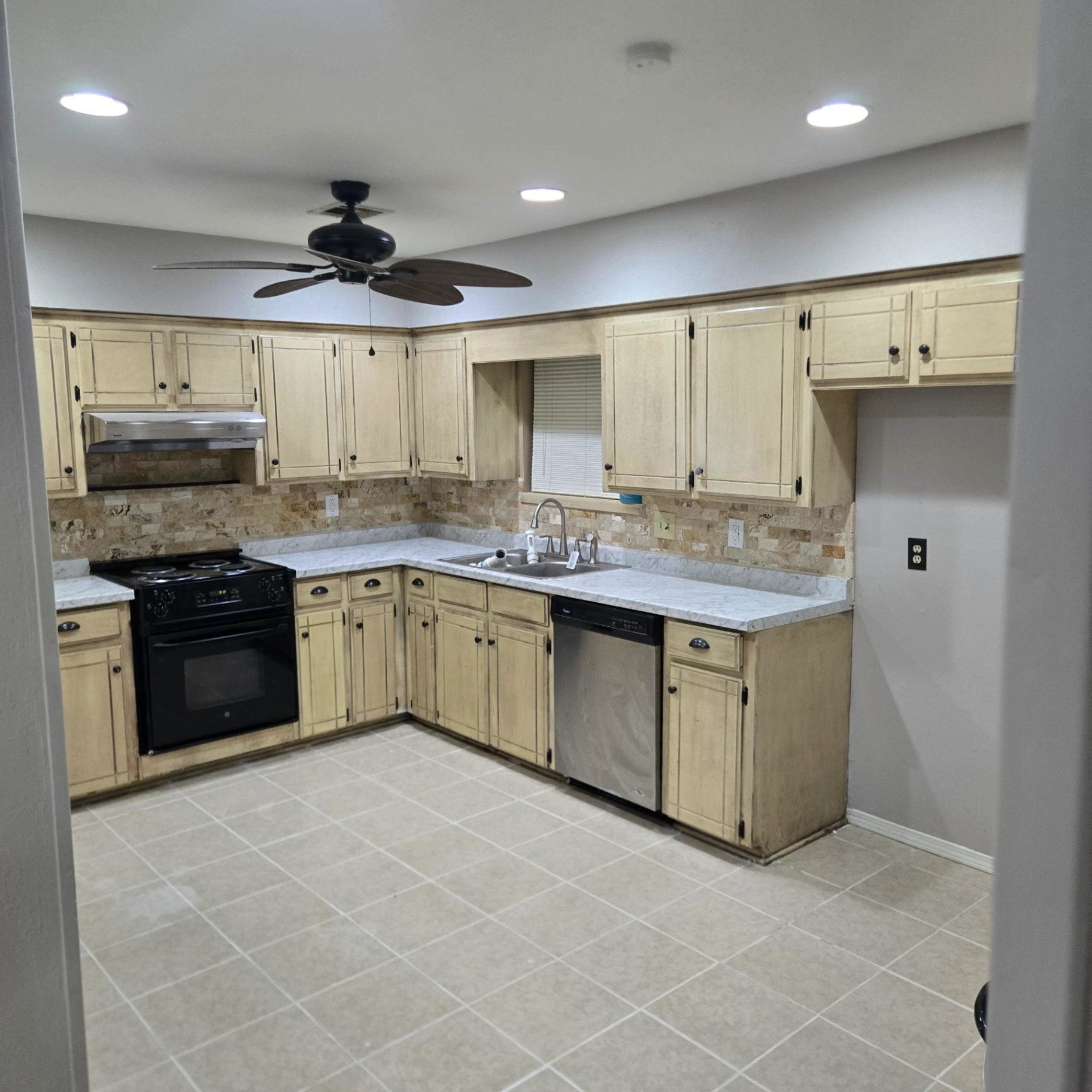 Kitchen remodel project with new cabinets and ceiling fan in Orlando OK