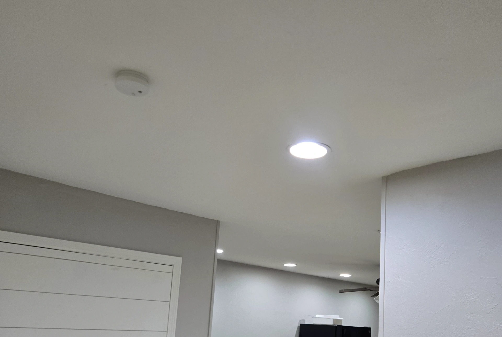 Smooth finished ceiling with recessed lighting installed by handyman in Perkins OK home
