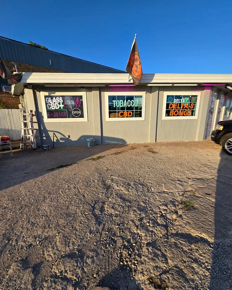 Pit's Smoke Shop original grey exterior before commercial painting project