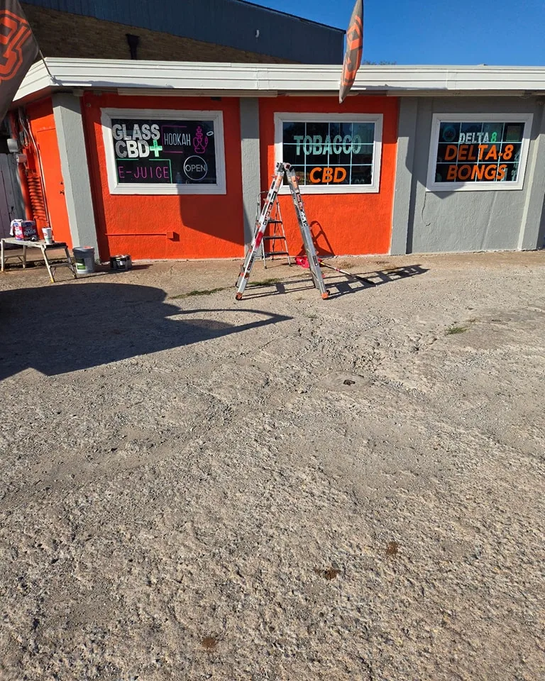 Commercial exterior painting in progress at Pit's Smoke Shop in Stillwater OK