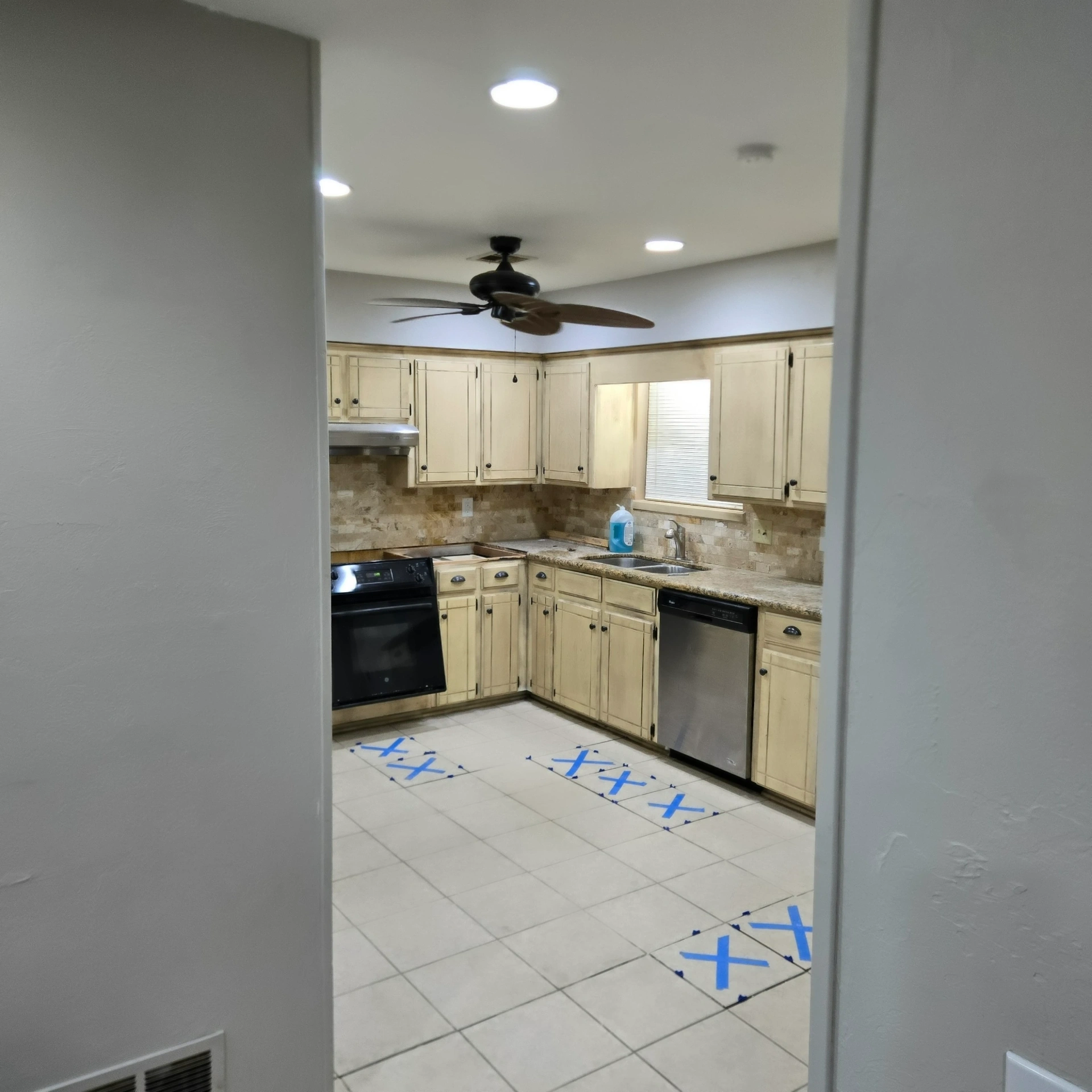 Kitchen floor tile preparation for remodeling project in Stillwater, OK