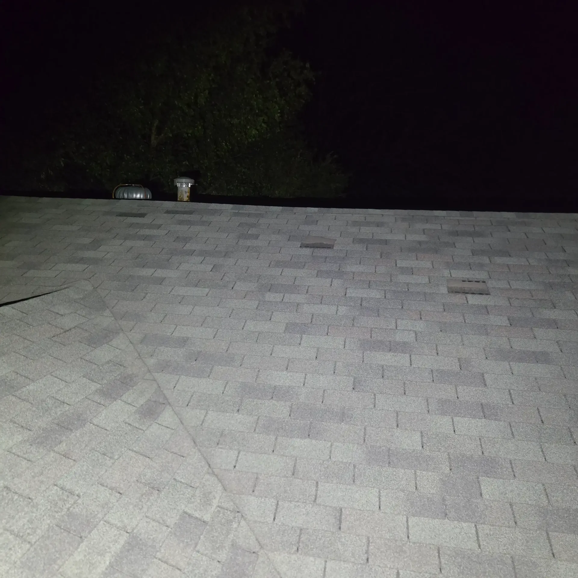 Gray shingle roof with multiple vents in Stillwater Oklahoma